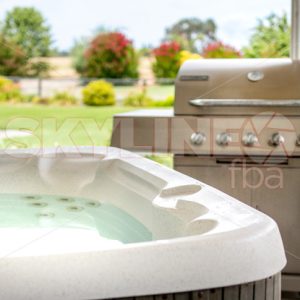 Hot Tub Next To BBQ on Bright Summer Day - Skyline FBA